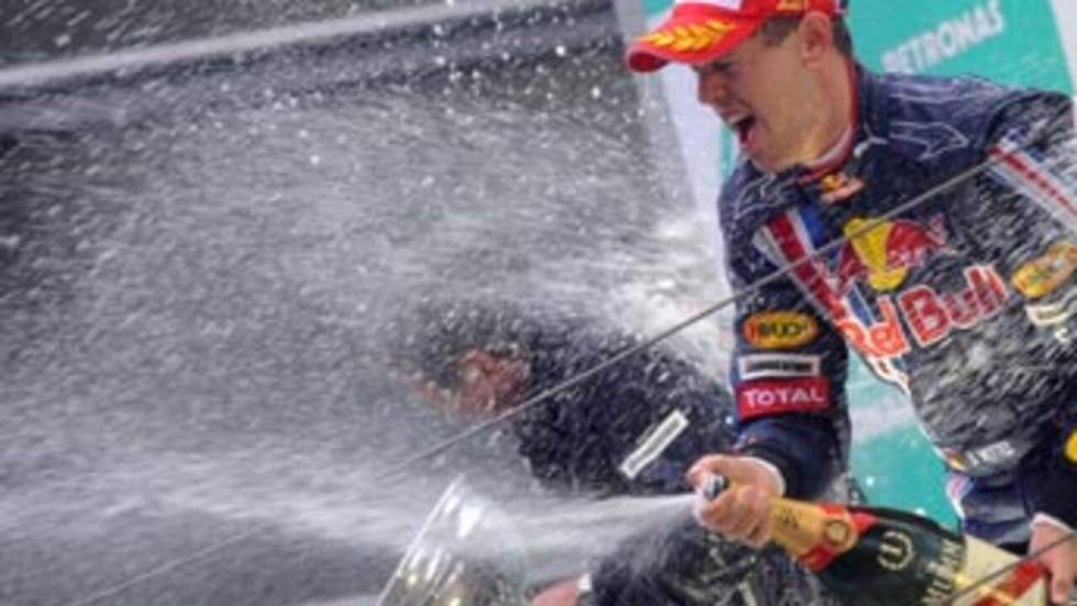 L'Allemand Sebastian Vettel s'impose sous la pluie L'Allemand Sebastian Vettel s'impose sous la pluie