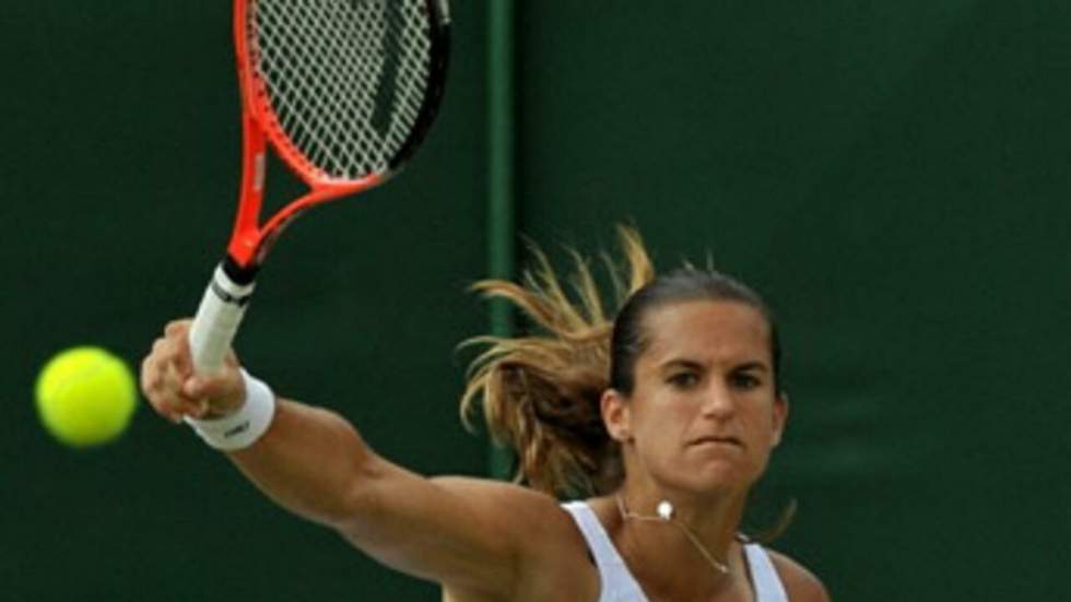 Mauresmo et Simon se hissent en huitièmes