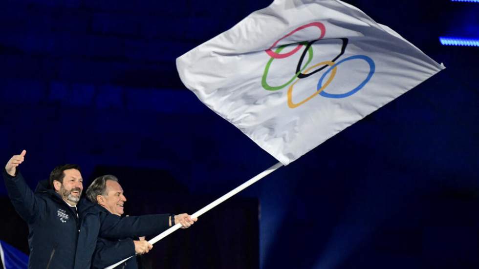 JO 2026 : le drapeau olympique remis aux Alpes françaises lors de la cérémonie de clôture JO 2026 : le drapeau olympique remis aux Alpes françaises lors de la cérémonie de clôture